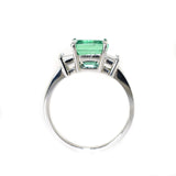 platinum emerald and diamond three stone ring